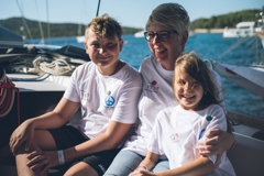 © mirno more Two children and an adult on a boat of the peace fleet mirno more