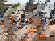 © Kniazha Ukrainian VIG colleagues build a wall