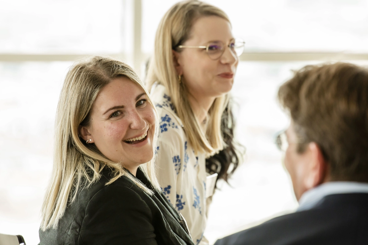 © Martin Marschall 3 employees talking to each other