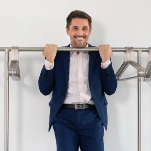 © Laurent Ziegler VIG Employee does a pull-up on the clothes rail
