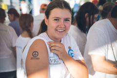 Participant of the peace fleet mirno more shows a painted tattoo on her upper arm