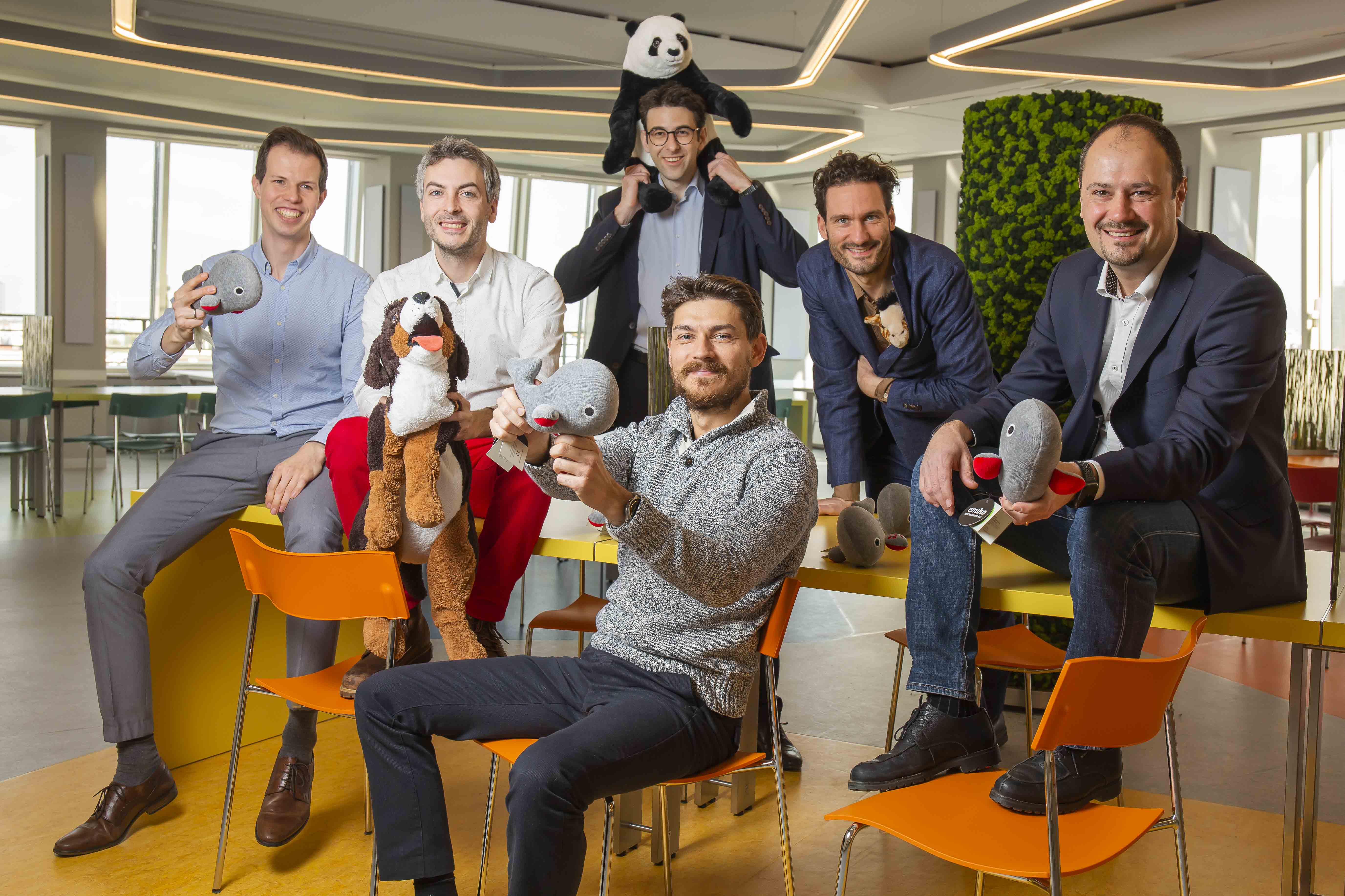 Round of good-humoured dads with plush toys