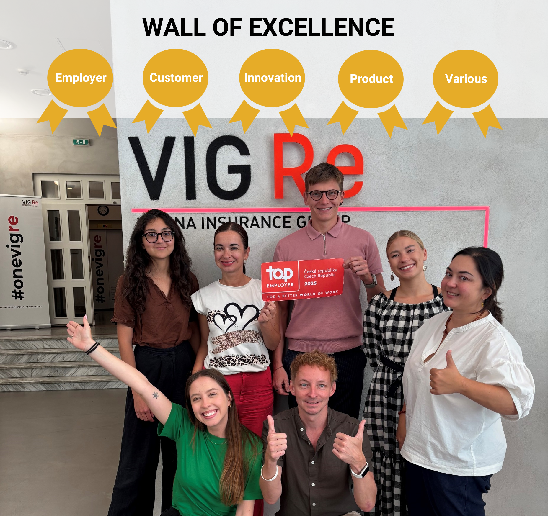 Employees of the Czech VIG company VIG Re proudly hold up their award for Top Employer 2025 in Czechia.