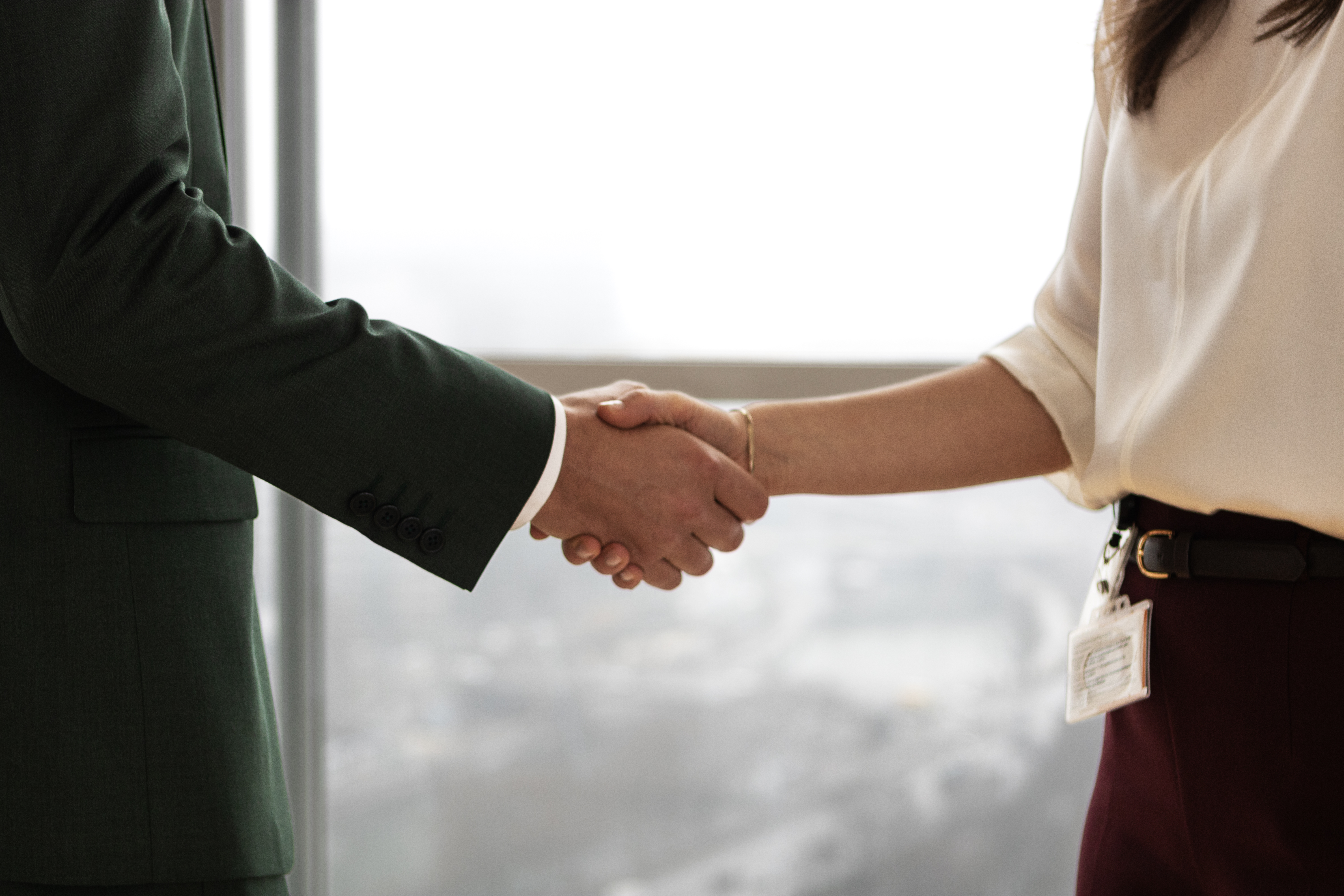 Man and woman shaking hands