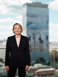 CFRO Liane Hirner standing, the Ringturm in the background