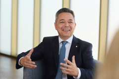 CIO Gábor Lehel in conversation and smiling