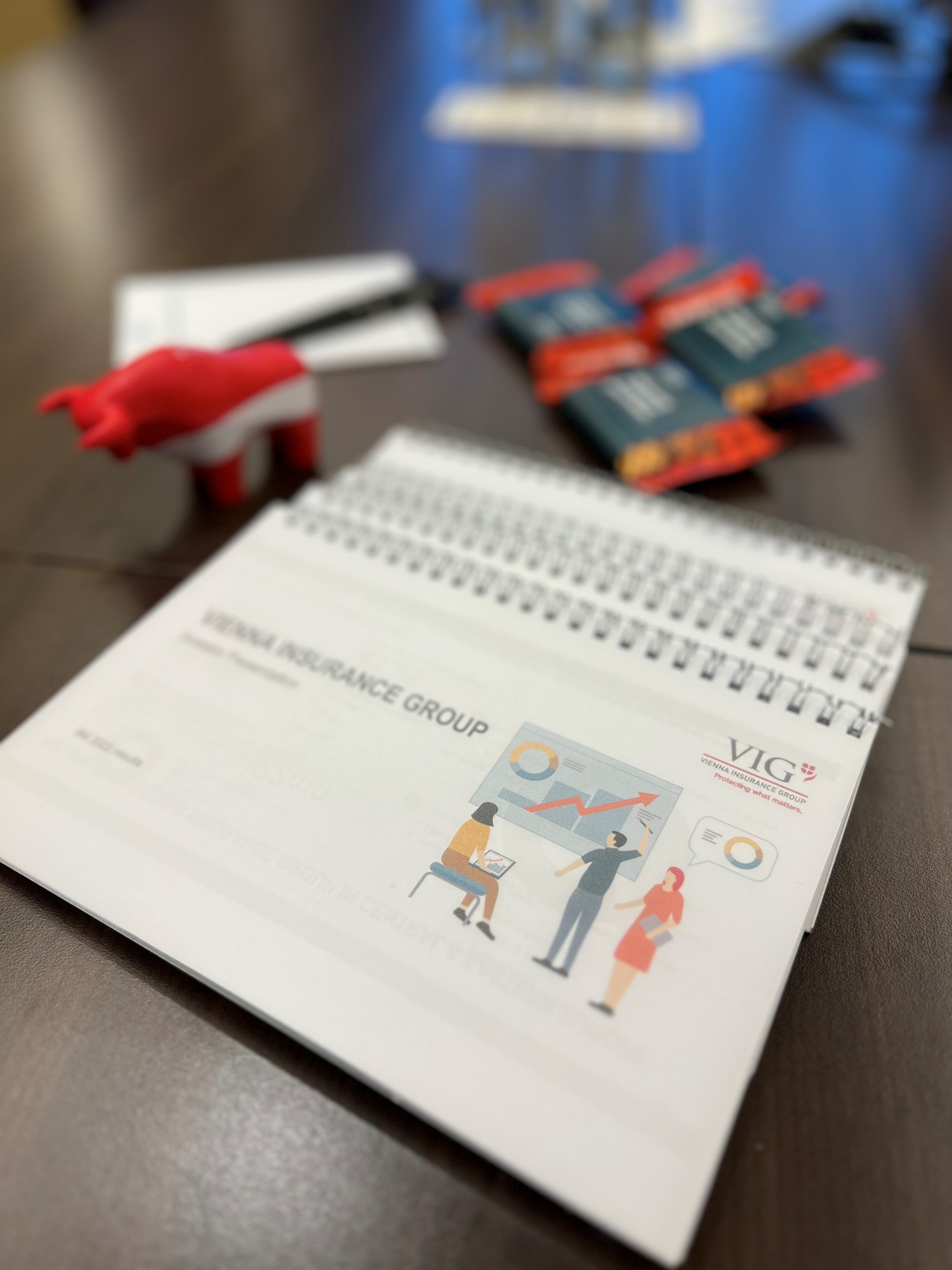 VIG presentation slides in front, mechandising articles of the Vienna Stock Exchange in the back